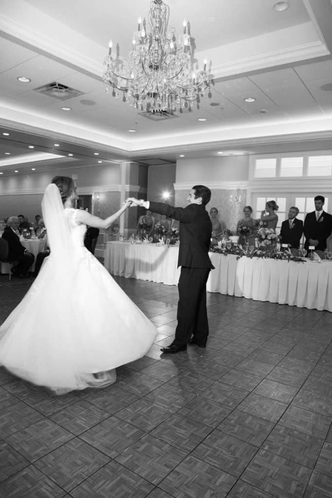 bride and groom dancing, wedding reception, black and white photo