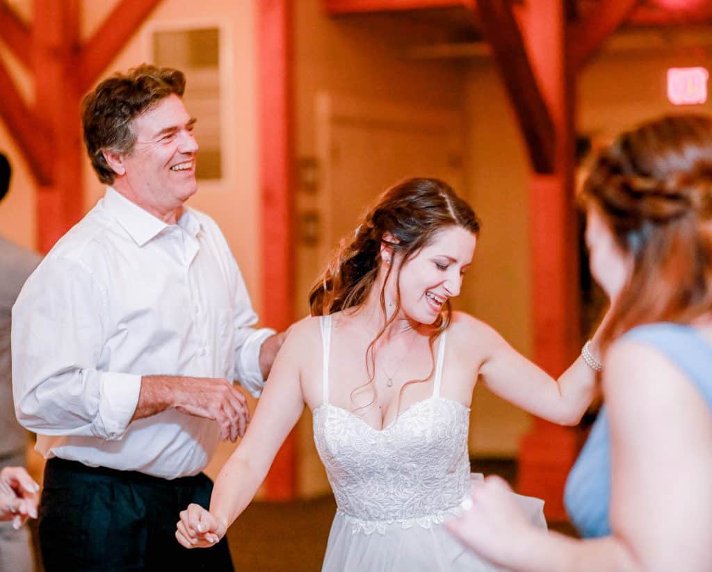 bride dancing during reception candidly