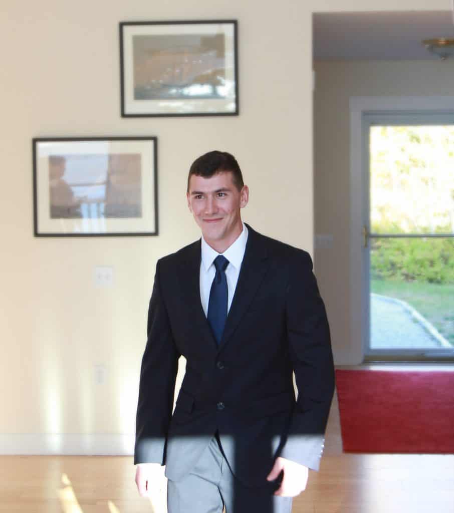 Groom walking down the isle 