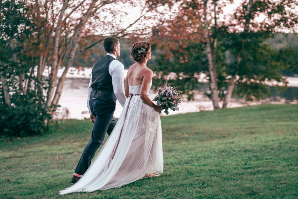 bride and groom walking to the reception