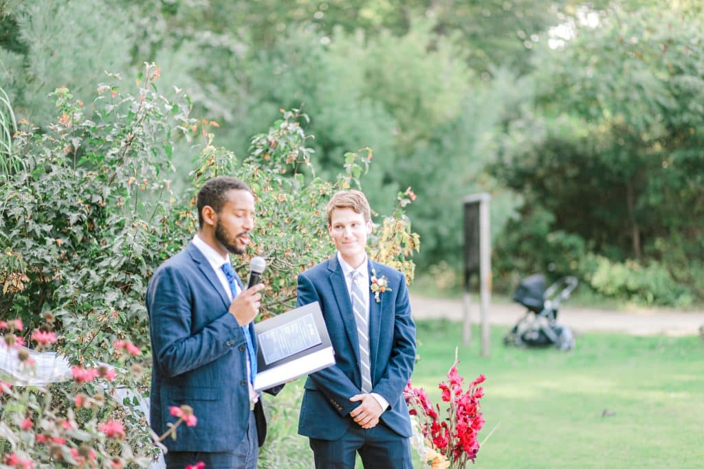 Groom standing at the alter with the preacher