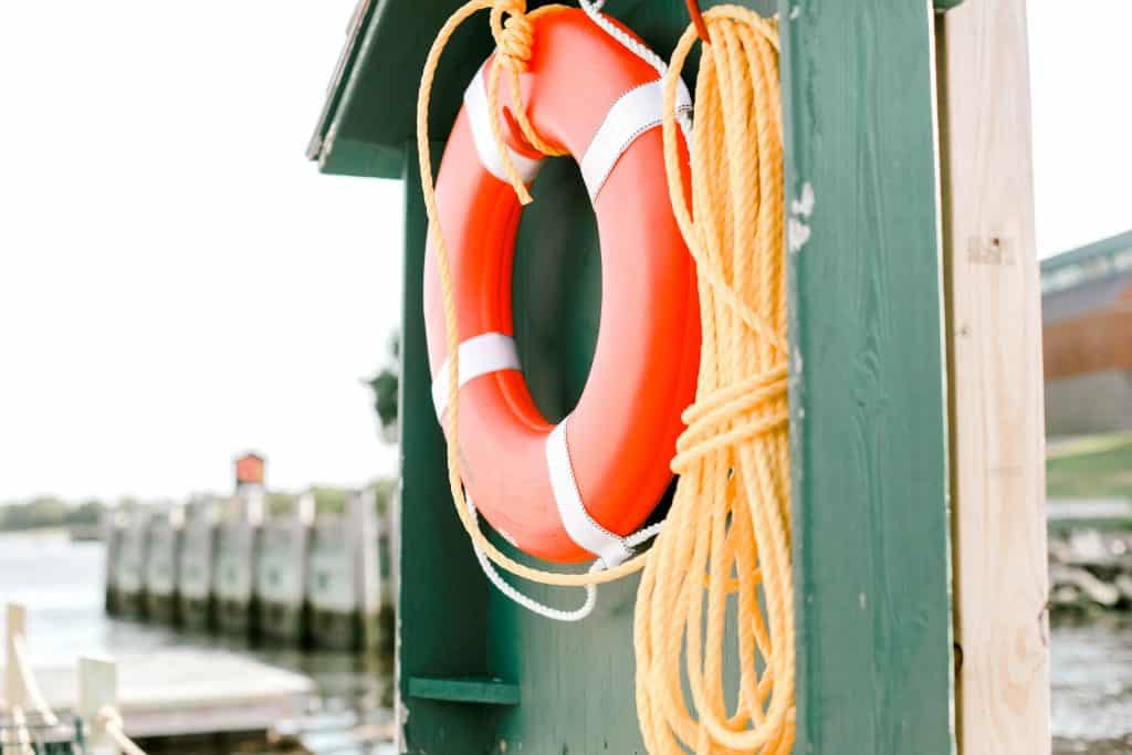 orange floatation device near the water