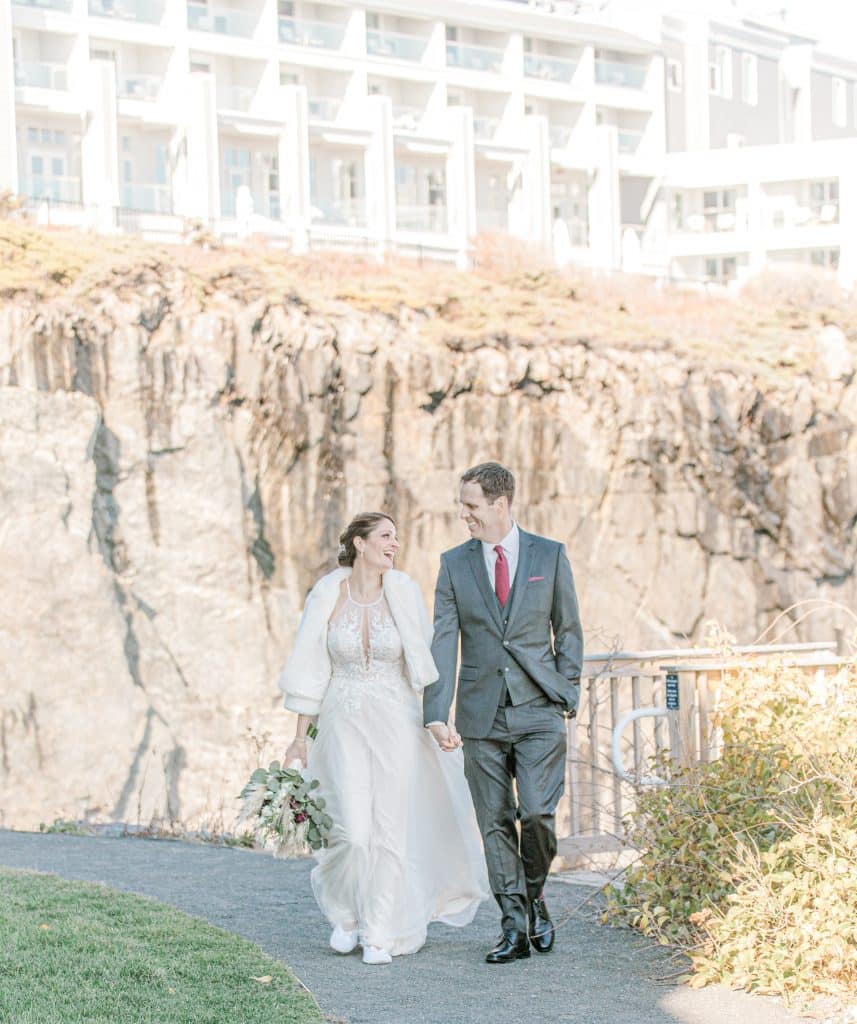 bride and groom walking at the Cliff House