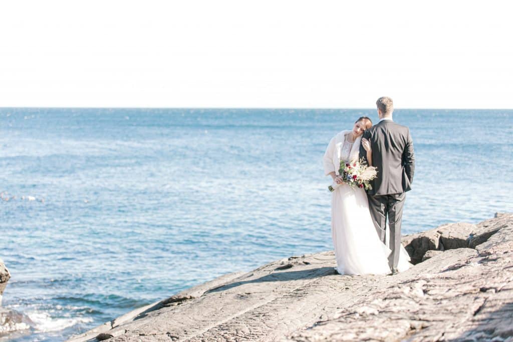 Bride and groom on the cliffs at the Cliff House 