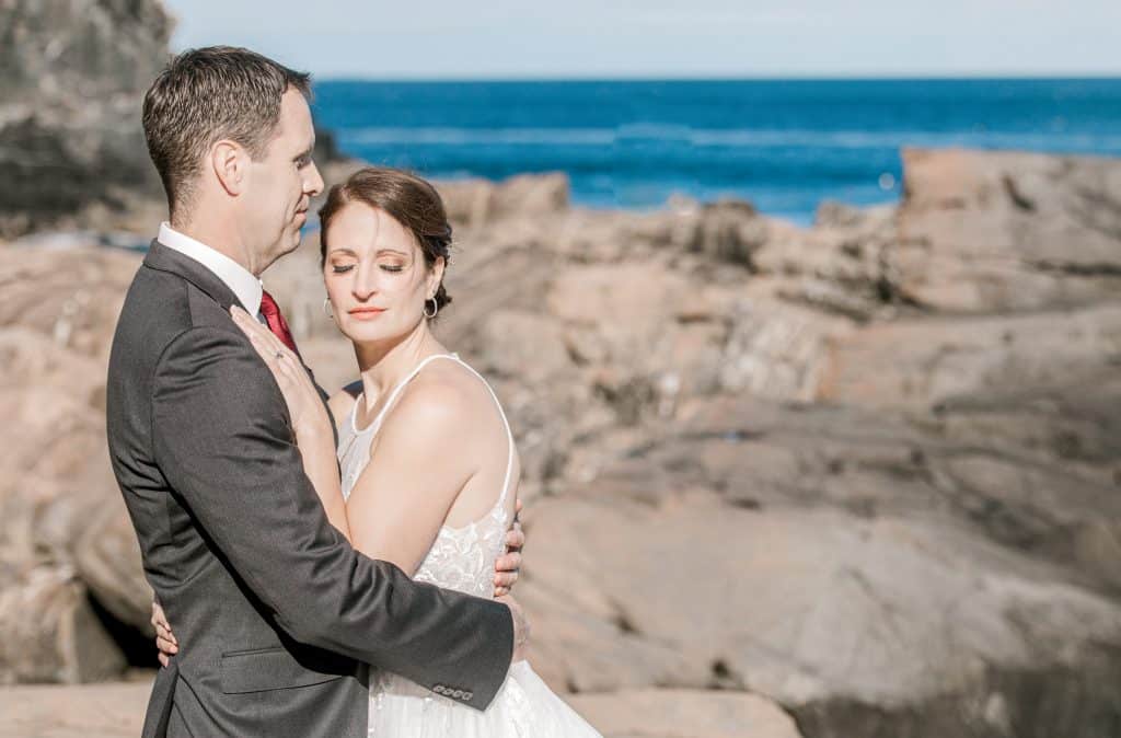 bride and groom on the cliffs at the cliff house