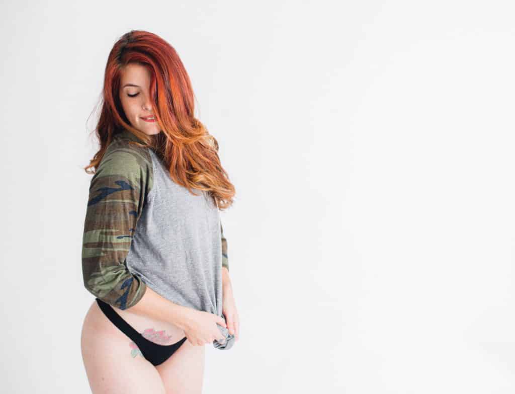 boudoir woman in studio with long graphic t-shirt 