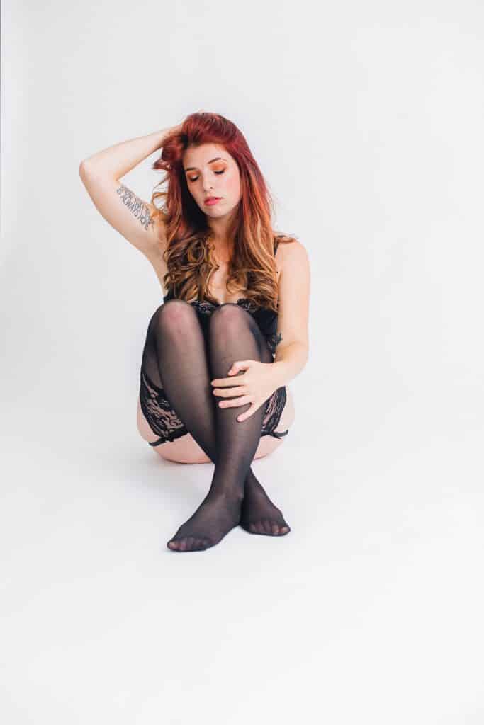 boudoir model in black lace lingerie in studio