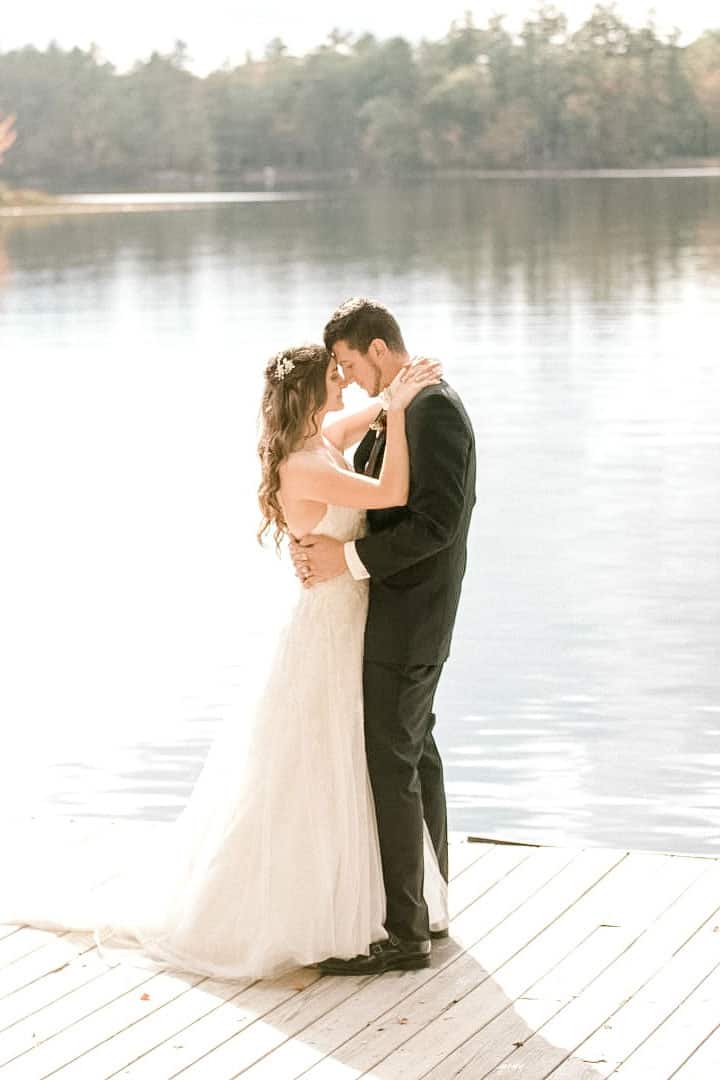 bride and groom on a maine lake near Bangor, Maine