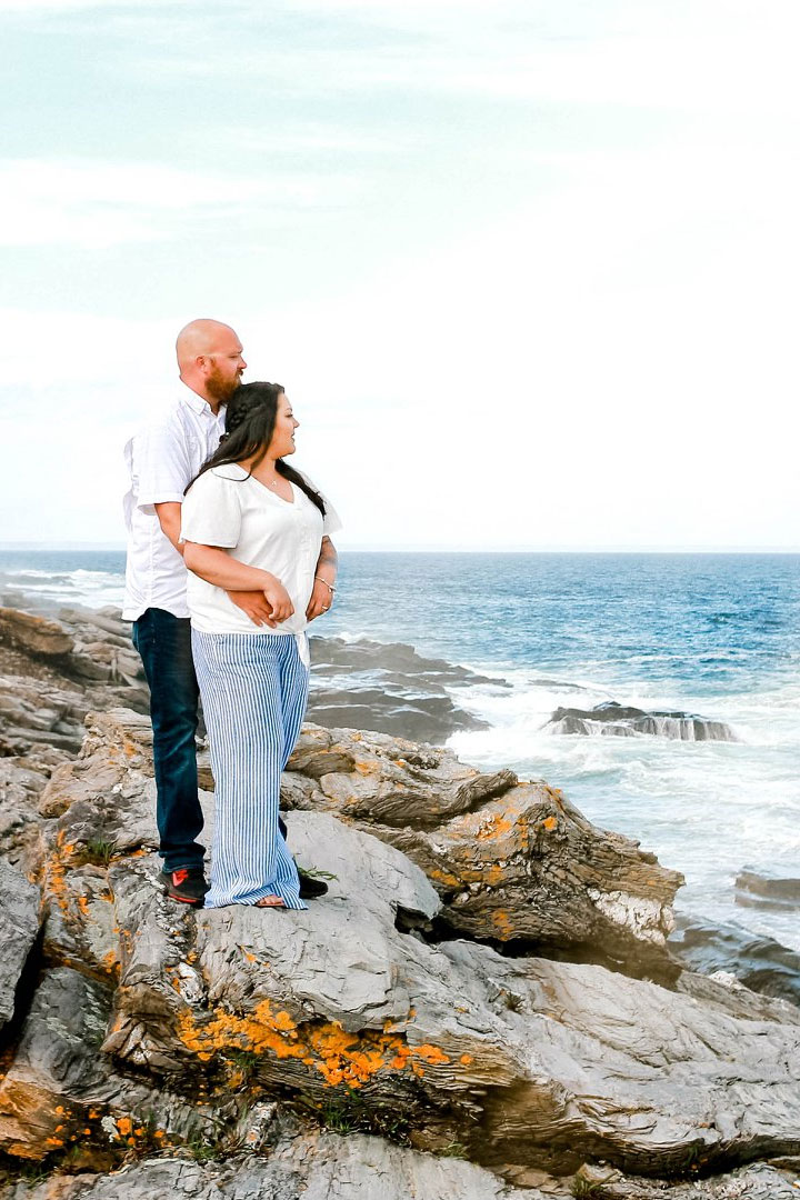 Maine engagement photo of engaged couple on a rocky Maine coastline