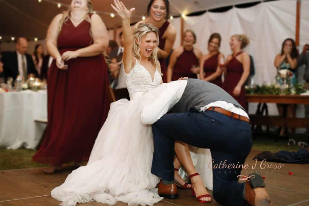 groom getting brides garter.