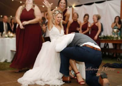 groom getting brides garter.