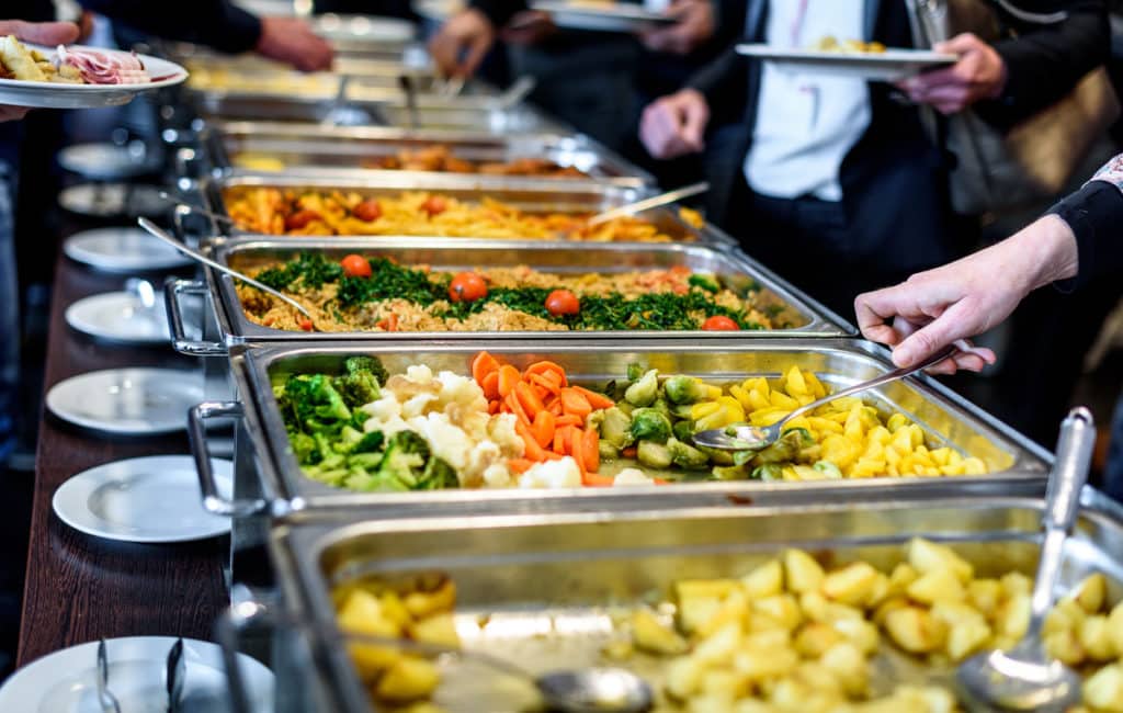 A wedding buffet spread with rice and vegetables