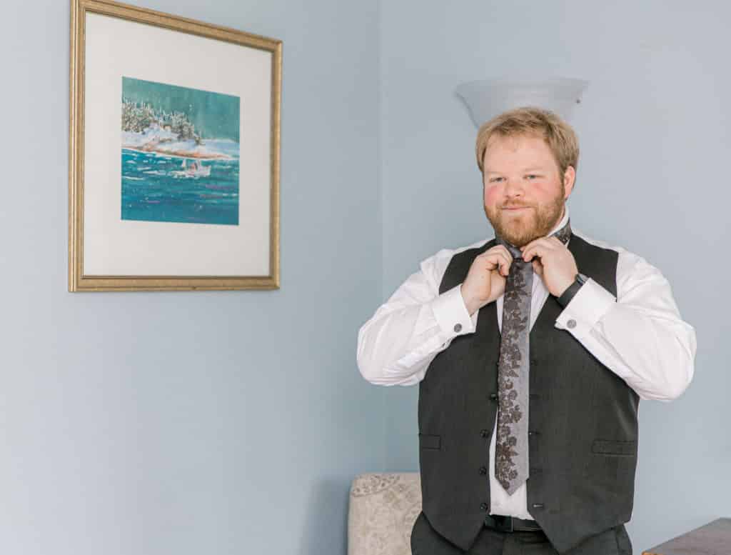 Groom getting ready for his wedding at Whitney Farm Estates