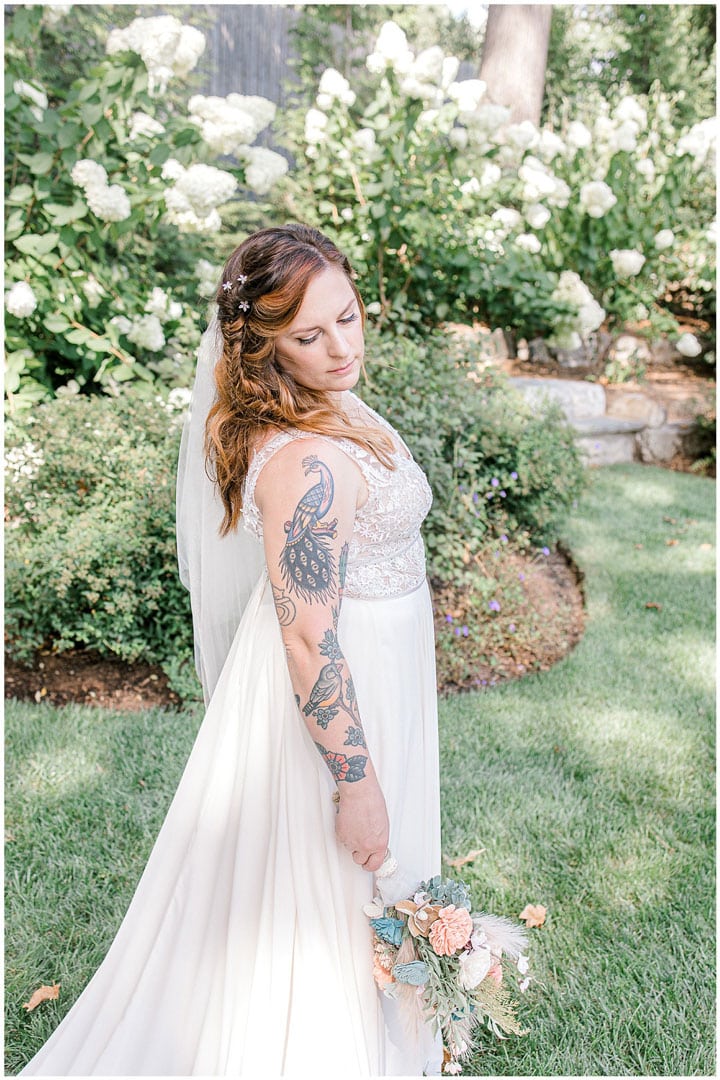 maine wedding photographer: Catherine J. Gross captures bride with arm tattoos and bouquet
