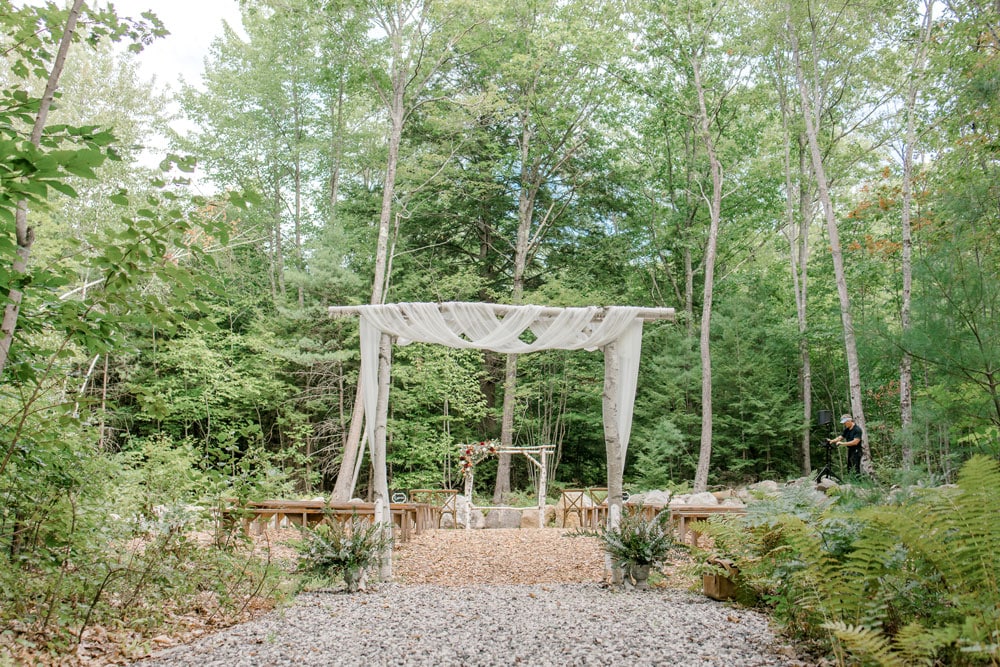garden gate at haley lodge wedding ceremony area with forest background