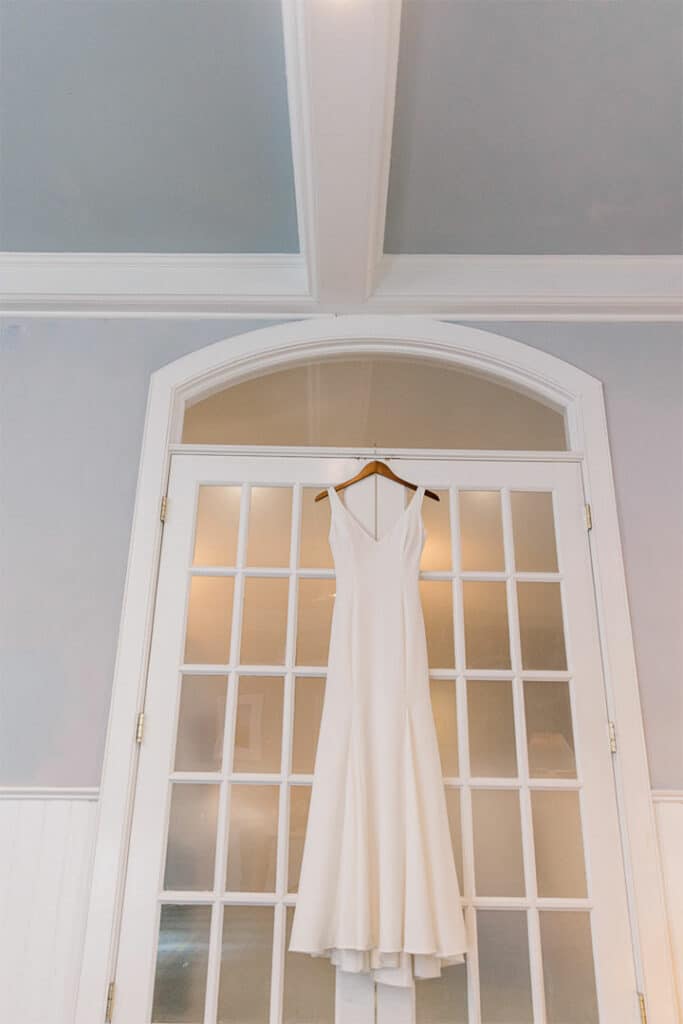 wedding dress hanging up at breakwater inn and spa