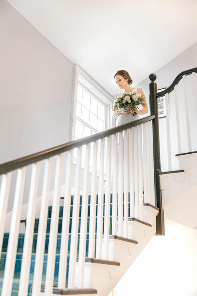 bride walking down stairs at breakwater in and spa - Kennebunkport, Maine