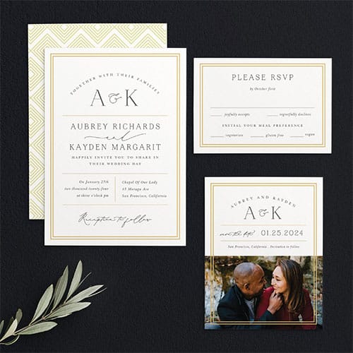 A wedding invitation suite featuring a light yellow geometric pattern. It includes an invitation card, RSVP card, and a photo of a couple embracing.