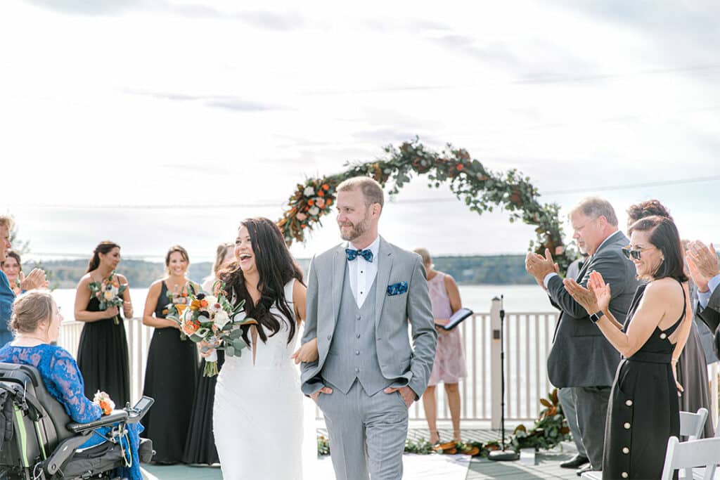 bride and groom walking down aisle