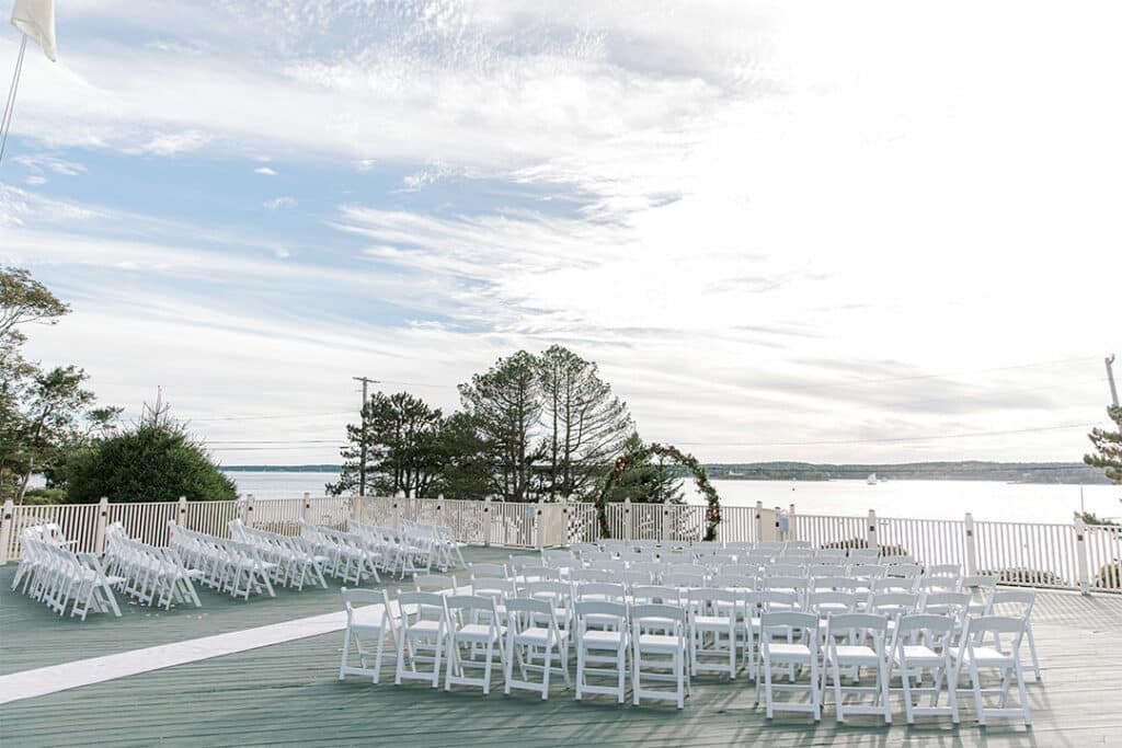 Spruce Point Inn Wedding Setup outside by the ocean